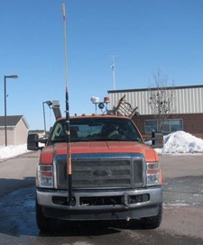 Height pole is attached to the front of a pickup truck.