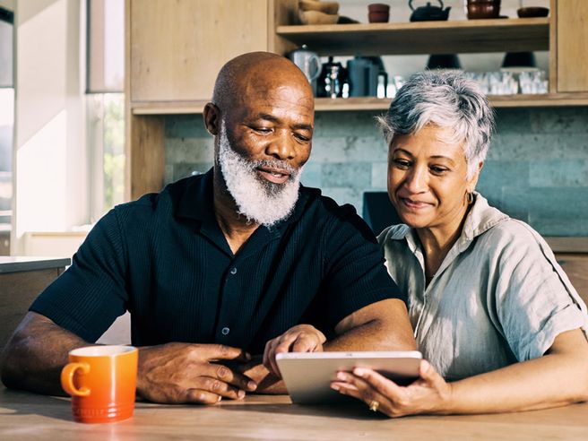 Man and woman looking at a tablet
