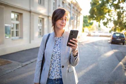 A woman looking at her phone