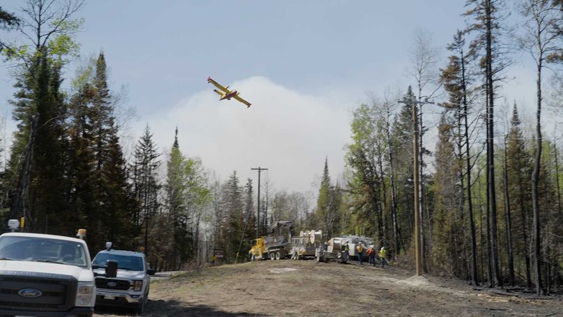 Manitoba Hydro restoration crews working alongside firefighting efforts in Eastern Manitoba.