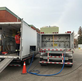 A compressed natural gas trailer supplying temporary gas during an outage.