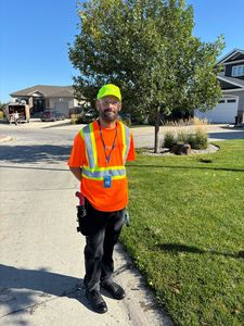 Manitoba Hydro gas inspector wearing appropriate identification.