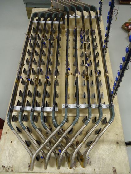 Five hydrogenerator stator coils undergoing thermal cycling testing.