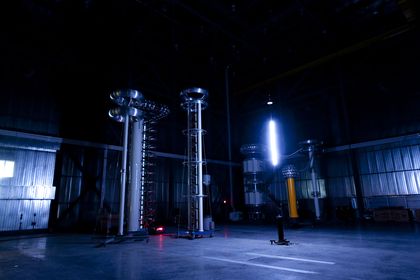High-voltage spark discharge across a rod gap inside the high voltage hall in a dark test hall