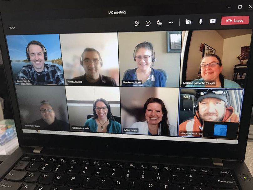 IAC volunteers group video meeting on a laptop screen.