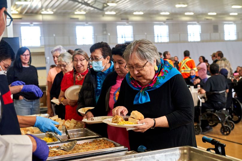 Indigenous elders are served a meal from the selection at the buffet.