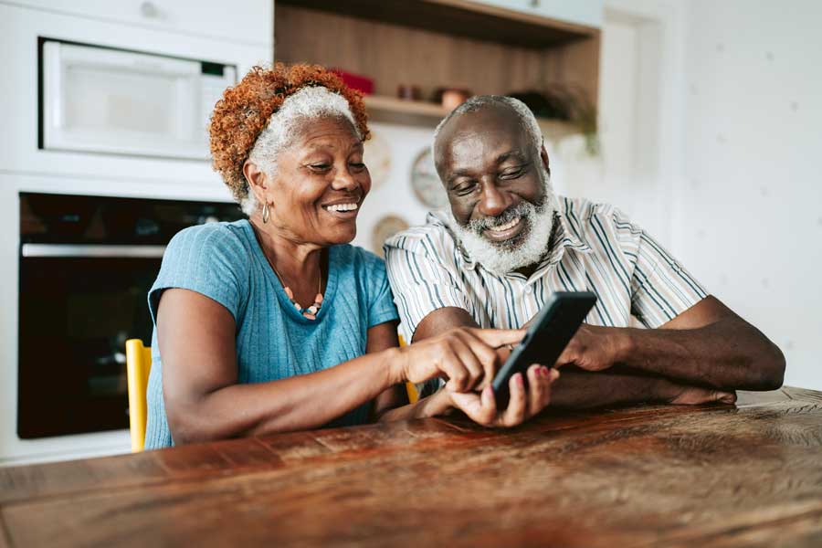 Senior couple using phone