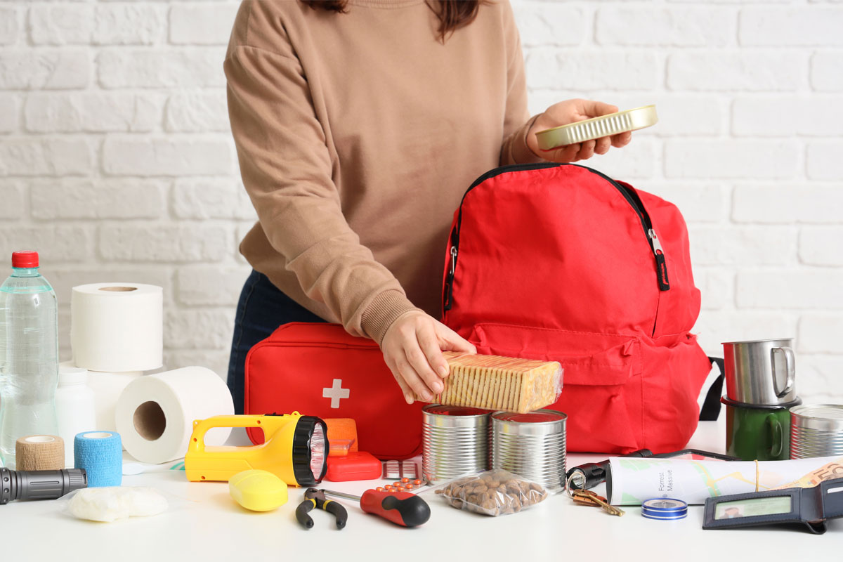 Woman organizing an emergency kit