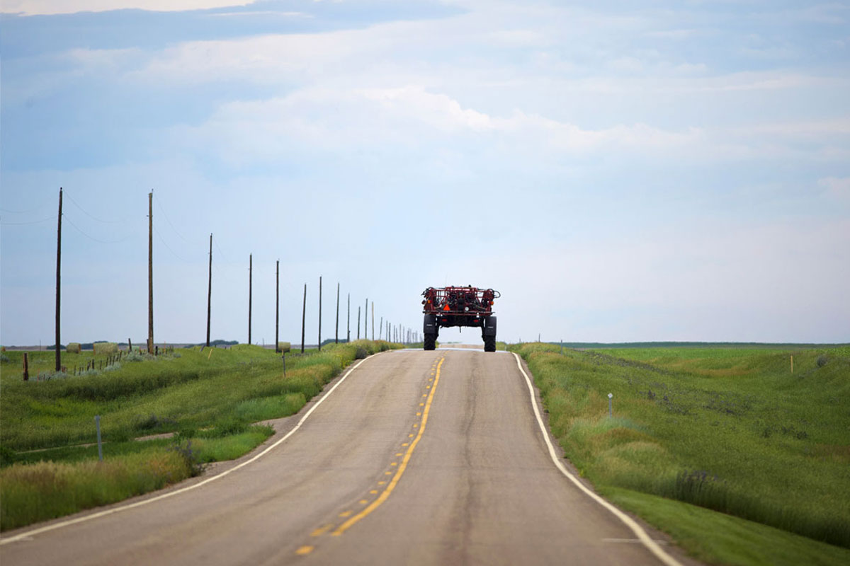 Farm equipment driving down road